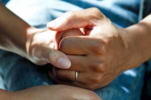 Caregiver holding someone's hand