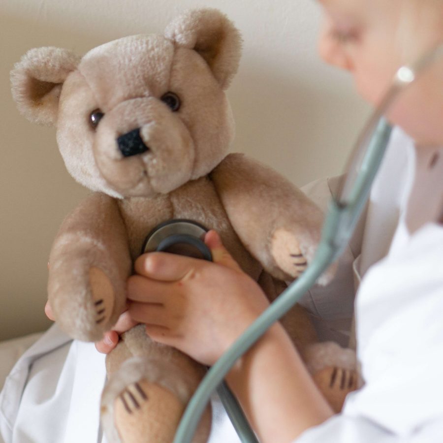 teddy bear and child with stethoscope teddy bear and child with stethoscope